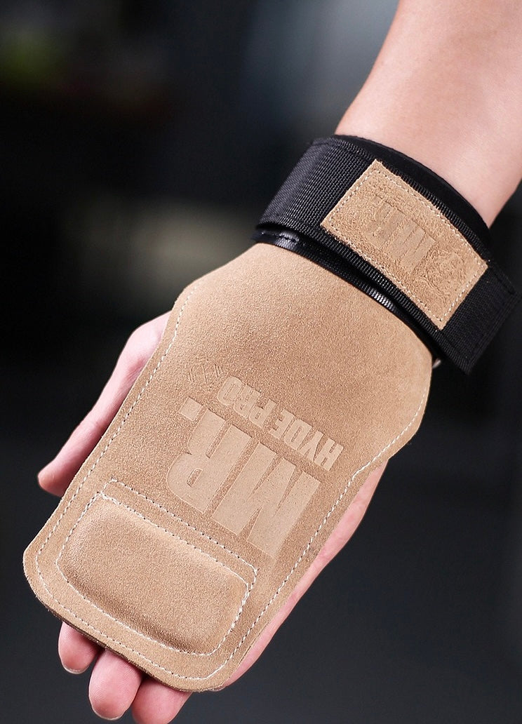 Athlete holding a barbell using brown leather lifting straps